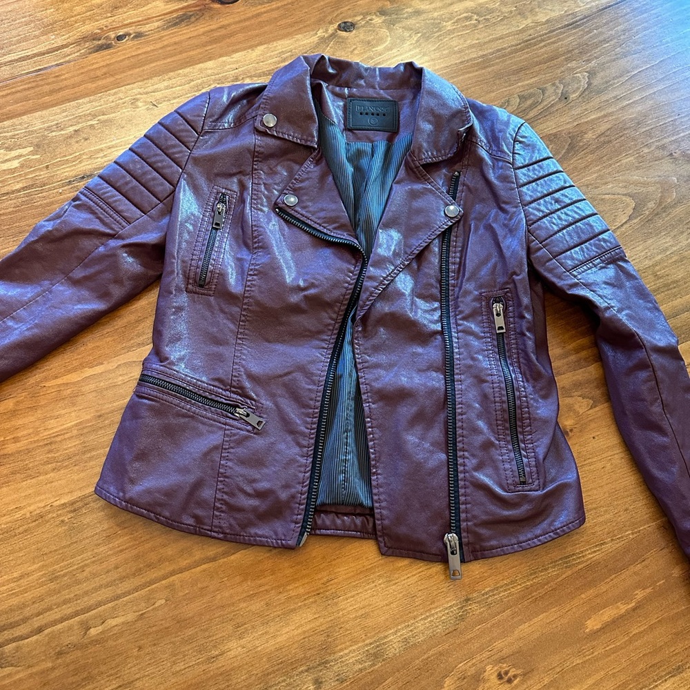 Maroon blank NYC vegan leather jacket. Zipper details on sleeves